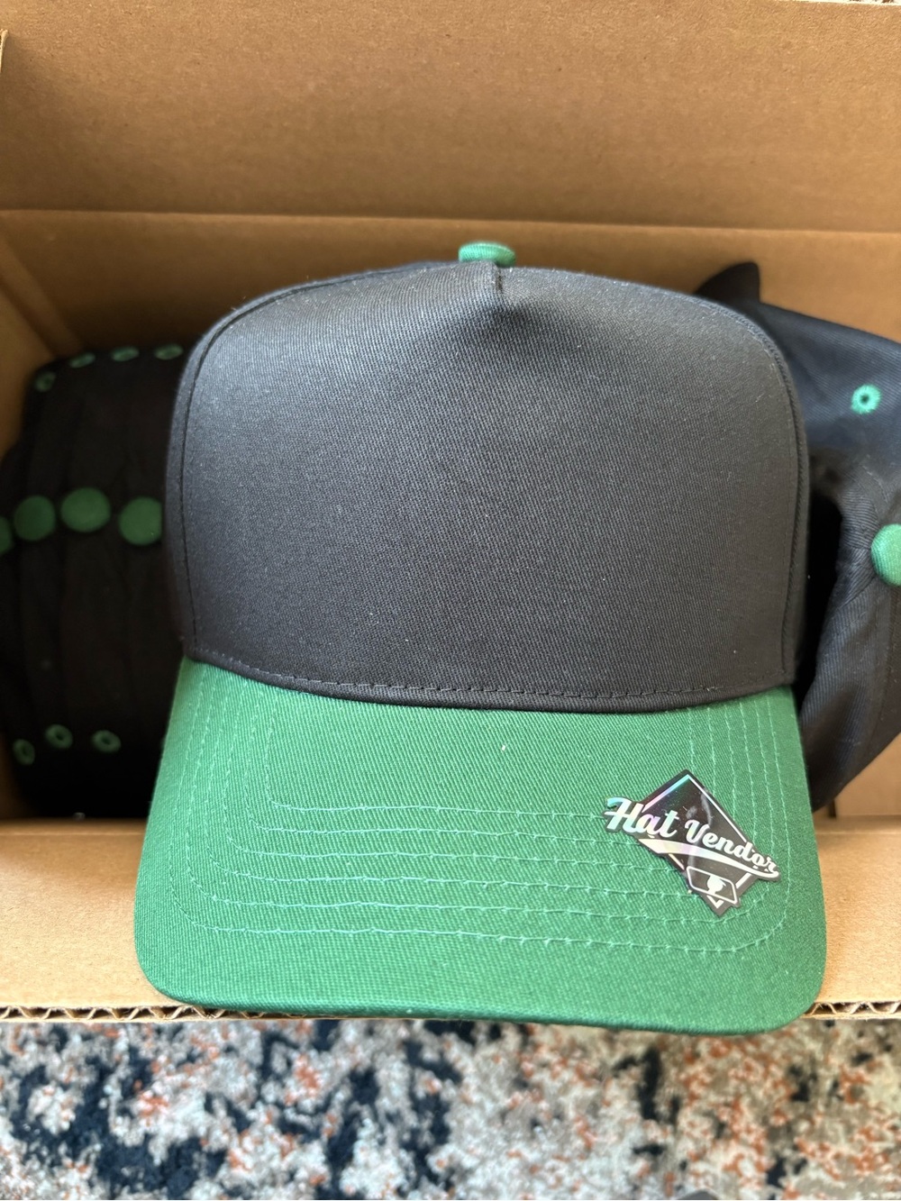 10 Blank Hat Vendor Two-Tone Black and Green Trucker Hat